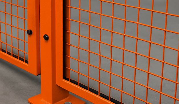 Close-up view of perimeter fencing around industrial machinery, illustrating safe gap spacing in compliance with CSA Z432 Table 9.1.